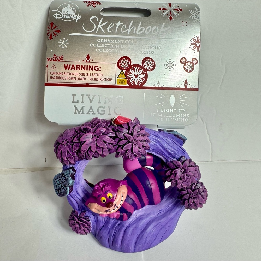 NWT. Disney Cheshire Cat Light-Up Living Magic Sketchbook Ornament